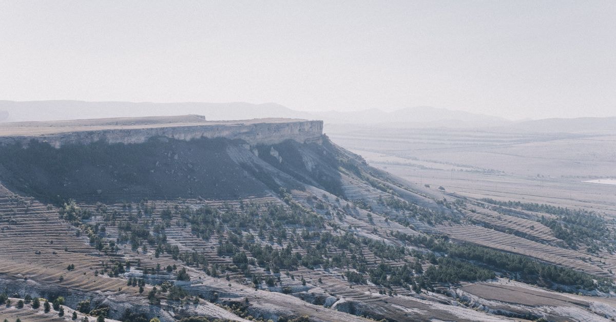 Sétif, Algeria: A Slow Travel Guide to the High Plateau A scenic view of eroded hills and layered landscapes under a clear sky.