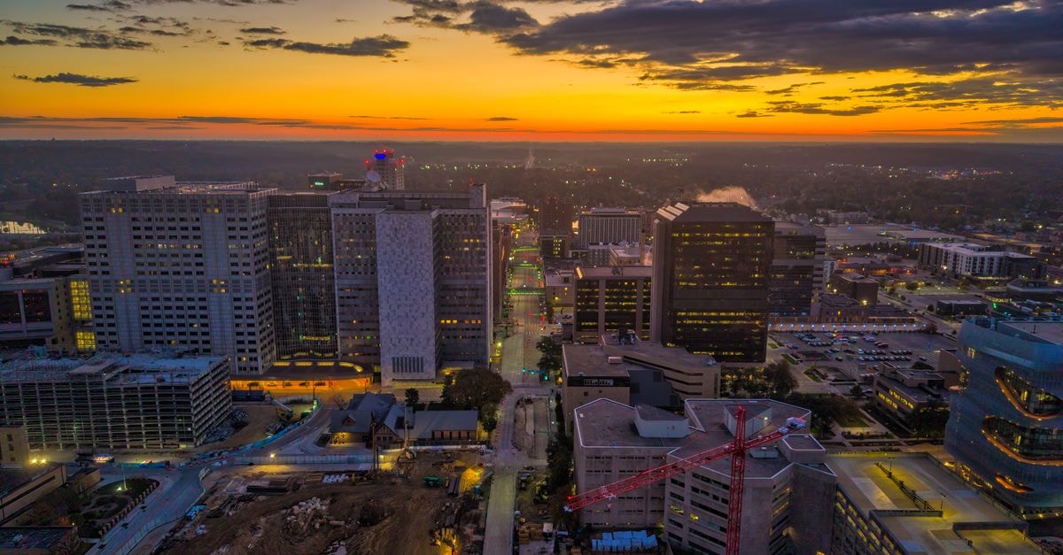A stunning aerial view of Rochester, Minnesota's skyline during a vibrant sunset.