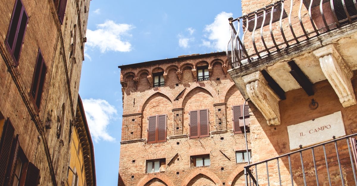 Hotel Palazzetto Rosso, Siena — History & Design in the Old Town Capture of medieval buildings at Il Campo in Siena, Tuscany, Italy.