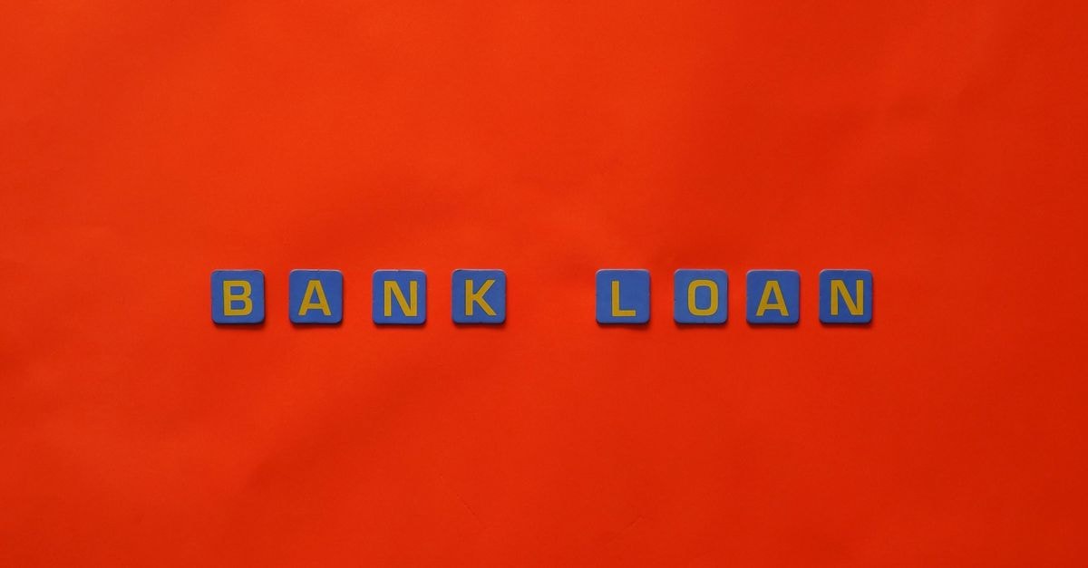 ICICI Bank Q2 Margin Slip Pressured by FCNR Funding Letters forming 'Bank Loan' on a vibrant red surface, ideal for finance themes.